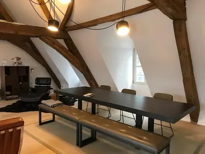 a dining room with a black table and chairs at Living The Dream in Ghent