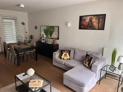 a living room with a couch and a table at BnB Antwerp Centrum in Antwerp