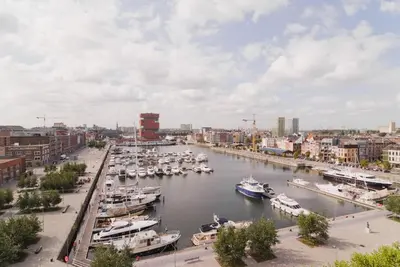 a group of boats docked in a harbor at BnB Antwerp Centrum in Antwerp