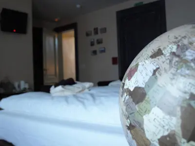 a room with a bed and a large globe at B&B Bon-Bon 'nuit' in Turnhout