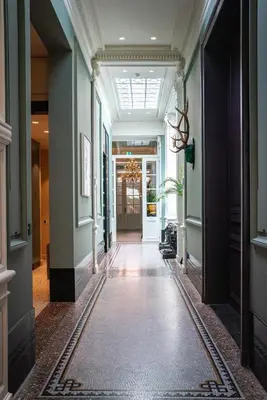 a hallway in a building with a ceiling at Cabosse, Boutique Palace & Spa in Antwerp