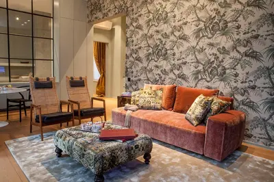 a living room with a couch and a table at Cabosse, Boutique Palace & Spa in Antwerp