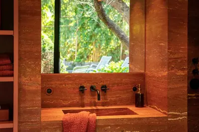a bathroom with a sink and a window at Cabosse, Boutique Palace & Spa in Antwerp