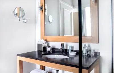 a bathroom with a sink and a mirror at Pillows Grand Boutique Hotel Reylof Ghent in Ghent
