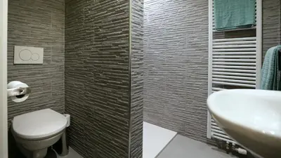 a bathroom with a toilet and a sink at B&B Handelshof in Lier