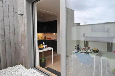 a view of a kitchen from the balcony of a apartment at B&B Kava in Antwerp