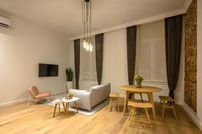 a living room with a couch and a table at Logement Den Beer in Meerhout