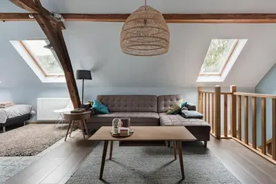 a living room with a couch and a table at Van Hamme 1642 - house for 2 to 4 persons in Kortenberg