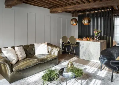 a living room with a couch and a table at Gulde Schoen Luxury Studio-apartments in Antwerp