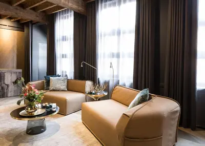 a living room with two couches and a table at Gulde Schoen Luxury Studio-apartments in Antwerp