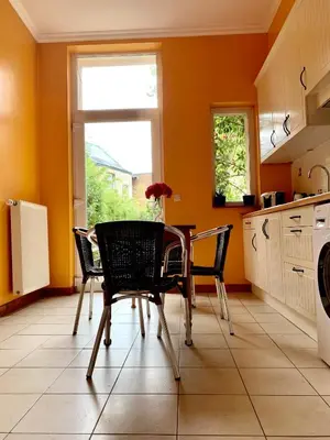 a kitchen with a table and chairs and a window at Bijou Brussels > Parvis St Pierre in Brussels