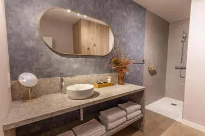 a bathroom with a sink and a mirror at Abalona Hotel & Apartments in Dendermonde