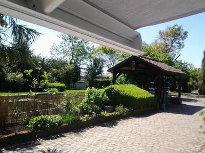 a gazebo in a park with plants at 't Vliethuys in Zwijndrecht