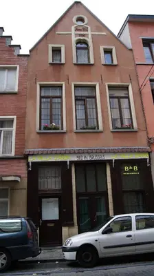 a white car parked in front of a building at B&B La Villa Zarin in Brussels