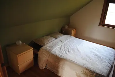 a bedroom with two twin beds and a window at 't Huizeke in Asse