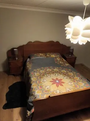 a bedroom with a bed with a blanket on it at The best known village of Belgium in Puurs