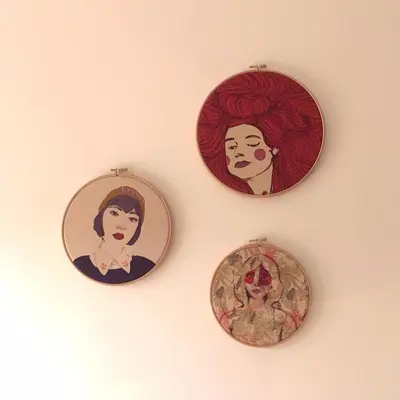 three plates with a picture of a woman on a wall at PM87- Modern stylish home in Antwerp