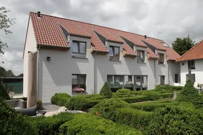 a house with a garden in front of it at B&B Dotter 17 in Erpe-Mere