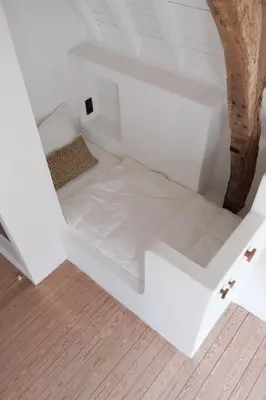an empty room with white walls and wood floors at Boutique Holiday Home ZaligInAntwerpen 77 in Antwerp