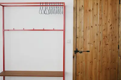 a room with a door and a wooden wall at Friday Gent, Exclusive Charming Guesthouse in Ghent