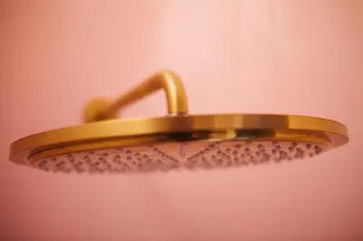 a close up of a bathroom light with golden at Friday Gent, Exclusive Charming Guesthouse in Ghent