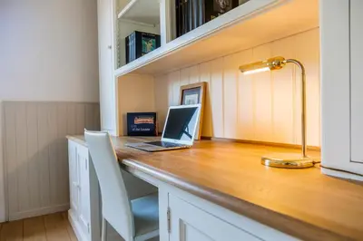 an office with a desk with a laptop on it at Brussels Expo Terrace Residence in Wemmel