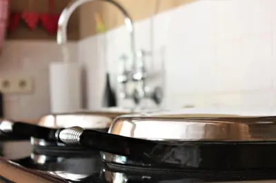 a pan sitting on top of a stove in a kitchen at De Volle Maan in Sint-Lievens-Houtem