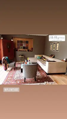 a living room with a couch and a table at Villa Plagniau in Rixensart
