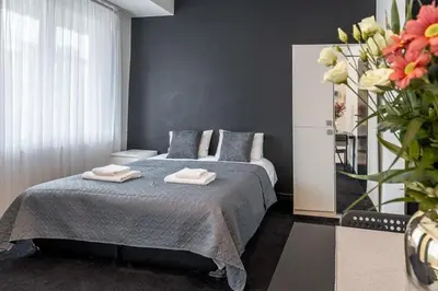 a bedroom with a bed with two towels on it at Albert gare du Midi 31 in Brussels