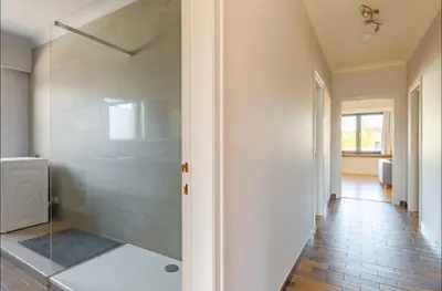 a bathroom with a shower with a glass door at Appartement224 in Grimbergen