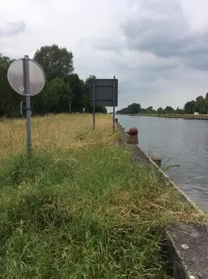 a sign on the side of a body of water at Appartement224 in Grimbergen