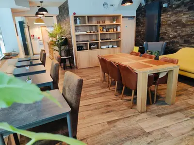a dining room with a table and chairs at Leuven City Hostel in Leuven