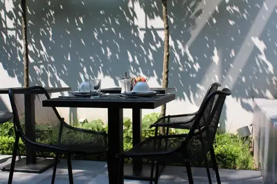 a black table and chairs on a patio at B&B A Côté du Cinquantenaire in Brussels