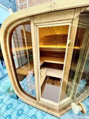 a wooden sauna with a glass door on the floor at Boutique B&B Graaf in Ghent