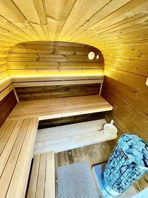 a sauna with a bench in a wooden room at Boutique B&B Graaf in Ghent
