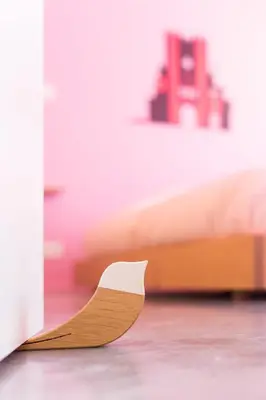 a wooden object sitting on the floor next to a bed at Boutique B&B Graaf in Ghent