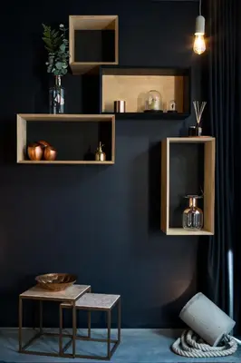 a living room with wooden shelves and a table at Boutique B&B Graaf in Ghent
