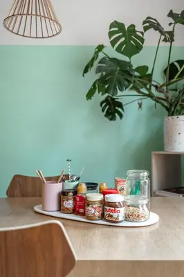 a table with a plate of food on a counter at Boutique B&B Graaf in Ghent