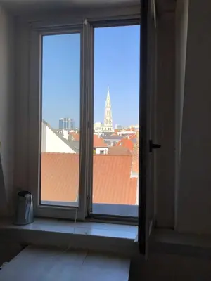 an open window with a view of a building at Olives in Brussels