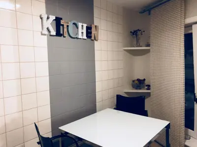 a white table and chairs in a room at Olives in Brussels