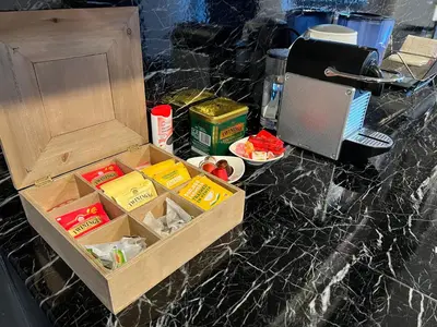 a box of food on a counter next to a cupboard at Modern cozy studio with backyard in Antwerp