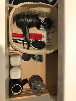 a drawer filled with cooking utensils and other kitchen items at Modern cozy studio with backyard in Antwerp