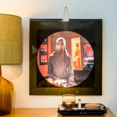 a picture of a man sitting on a table with a glass at A Place Antwerp - Boutique Suites & Flats - Vrijdagmarkt 1 in Antwerp