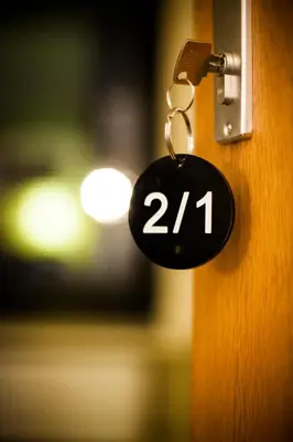 a lock on a door with the number at A Place Antwerp - Boutique Suites & Flats - Vrijdagmarkt 1 in Antwerp