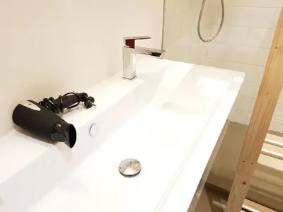 a bathroom with a sink and a shower at The Meir Lodge. Apartments in heart of Antwerp in Antwerp