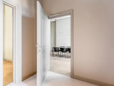 a door leading to a dining room with a table at Numa Brussels Lief in Brussels