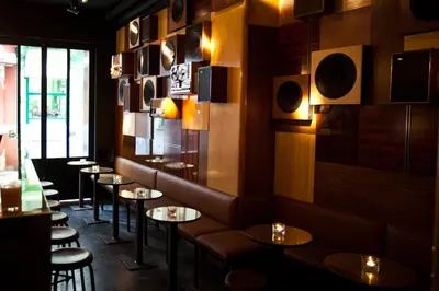 a row of tables and chairs in a restaurant at HotelO Kathedral in Antwerp