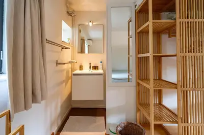 a small bathroom with a sink and a mirror at Guest house Huize De Wit in Keerbergen