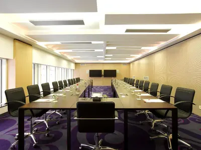 a large conference room with long tables and chairs at Thon Hotel EU in Brussels