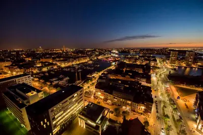 a view of a city at night with traffic at Exclusieve privé wellness penthouse SkyNooz in Antwerp